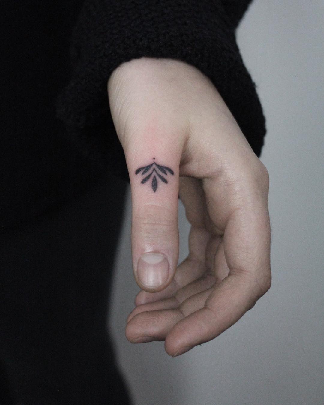 Hand-poked tiny Lotus tattoo by Lara Maju 