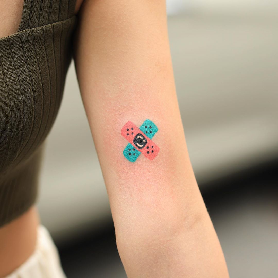 Hand-poked tiny band-aid tattoo by zzizziboy 