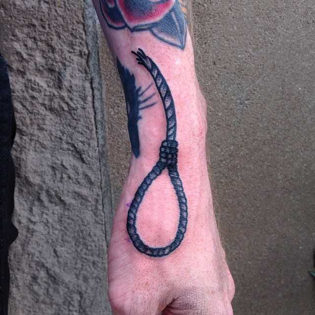 Hangman’s knot tattoo by Tine DeFiore
