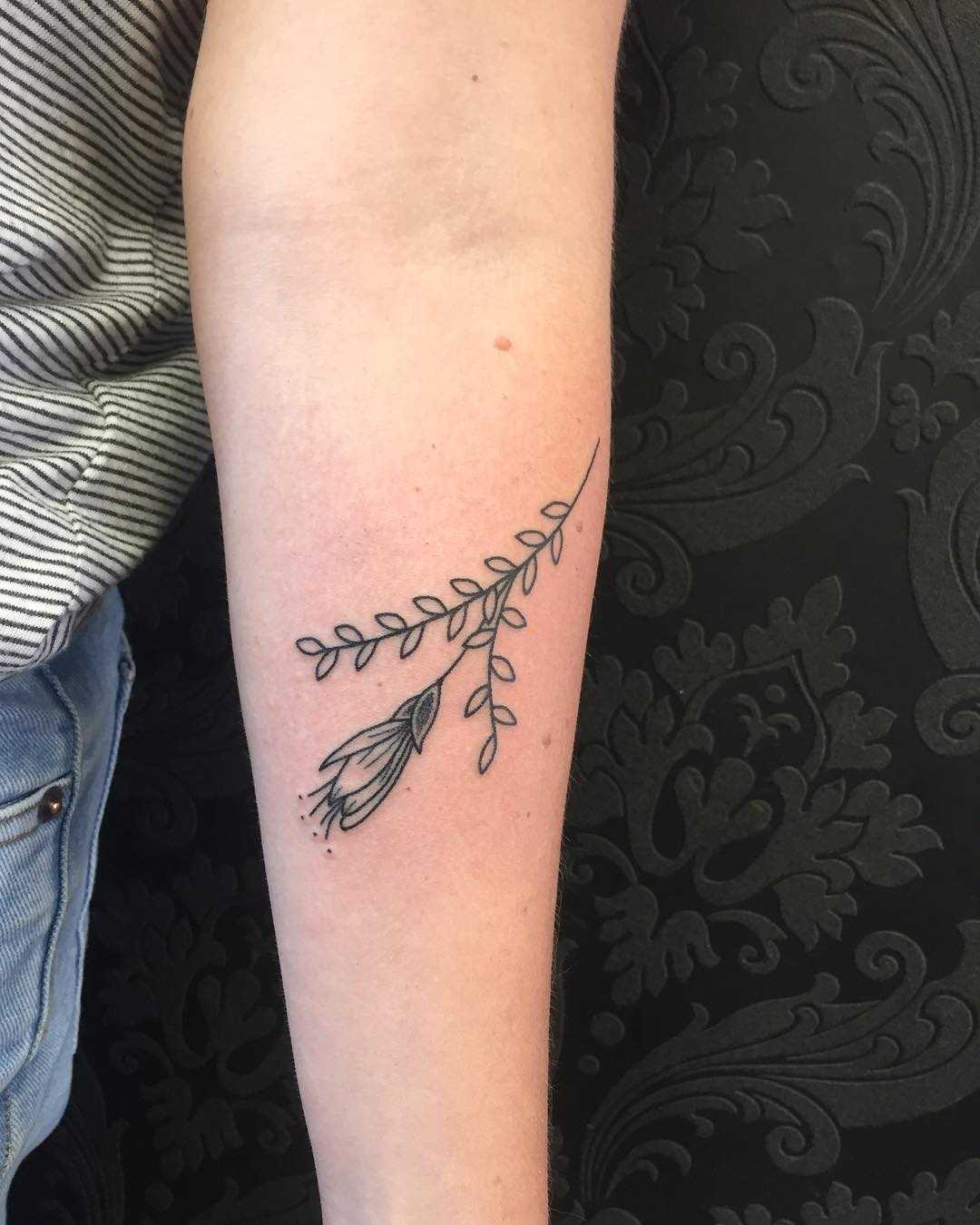 Kowhai flower and branch tattoo by Kirk Budden