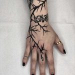 Lightening thorn tattoo by Tine DeFiore