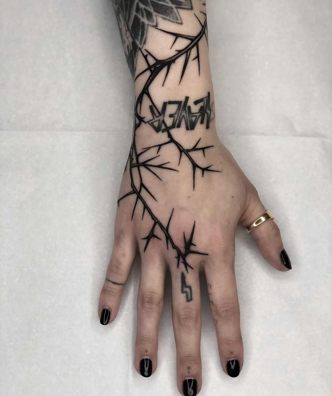 Lightening thorn tattoo by Tine DeFiore