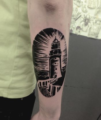 Lighthouse tattoo on a forearm by Eugene Dusty Past
