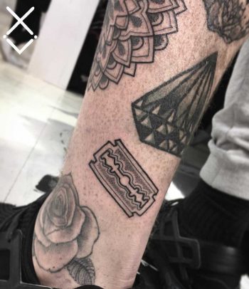 Little razor blade tattoo by Loz Thomas