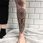 Mandala tattoo on a shin by tattooist Smutek