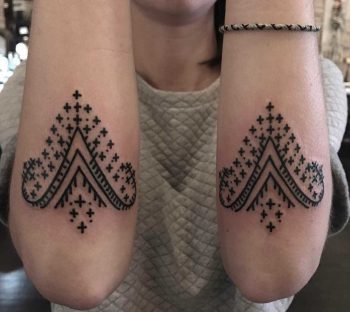 Matching forearm ornaments by Tine DeFiore