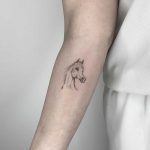 Minimalist horse tattoo by Conz Thomas