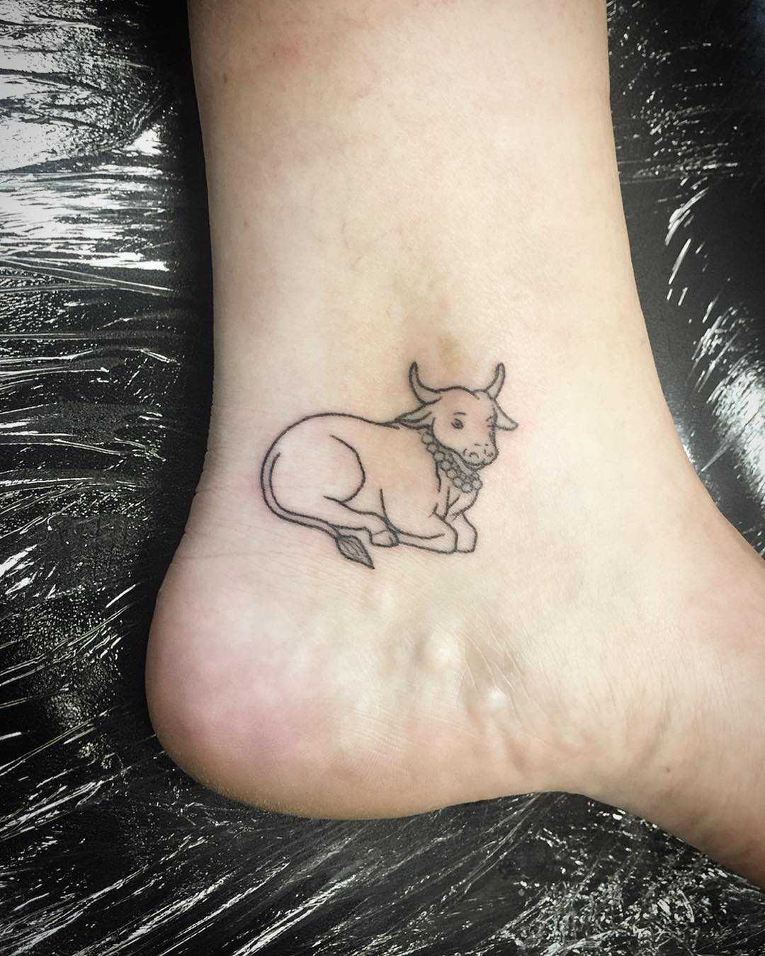 Nandi Cow tattoo by Kirk Budden