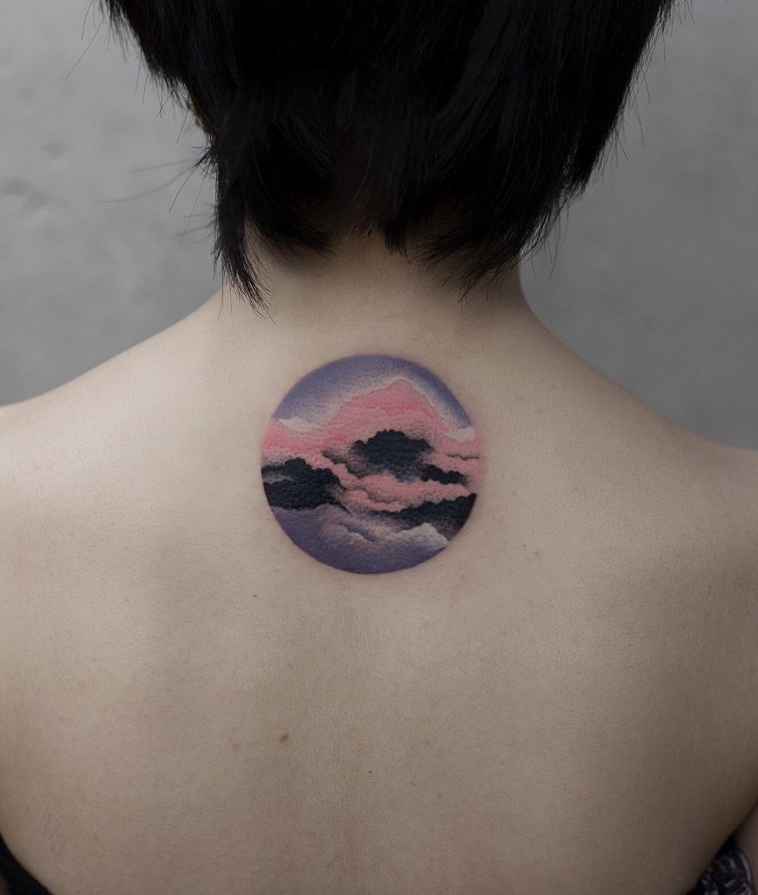 Pink clouds tattoo by Aki Wong