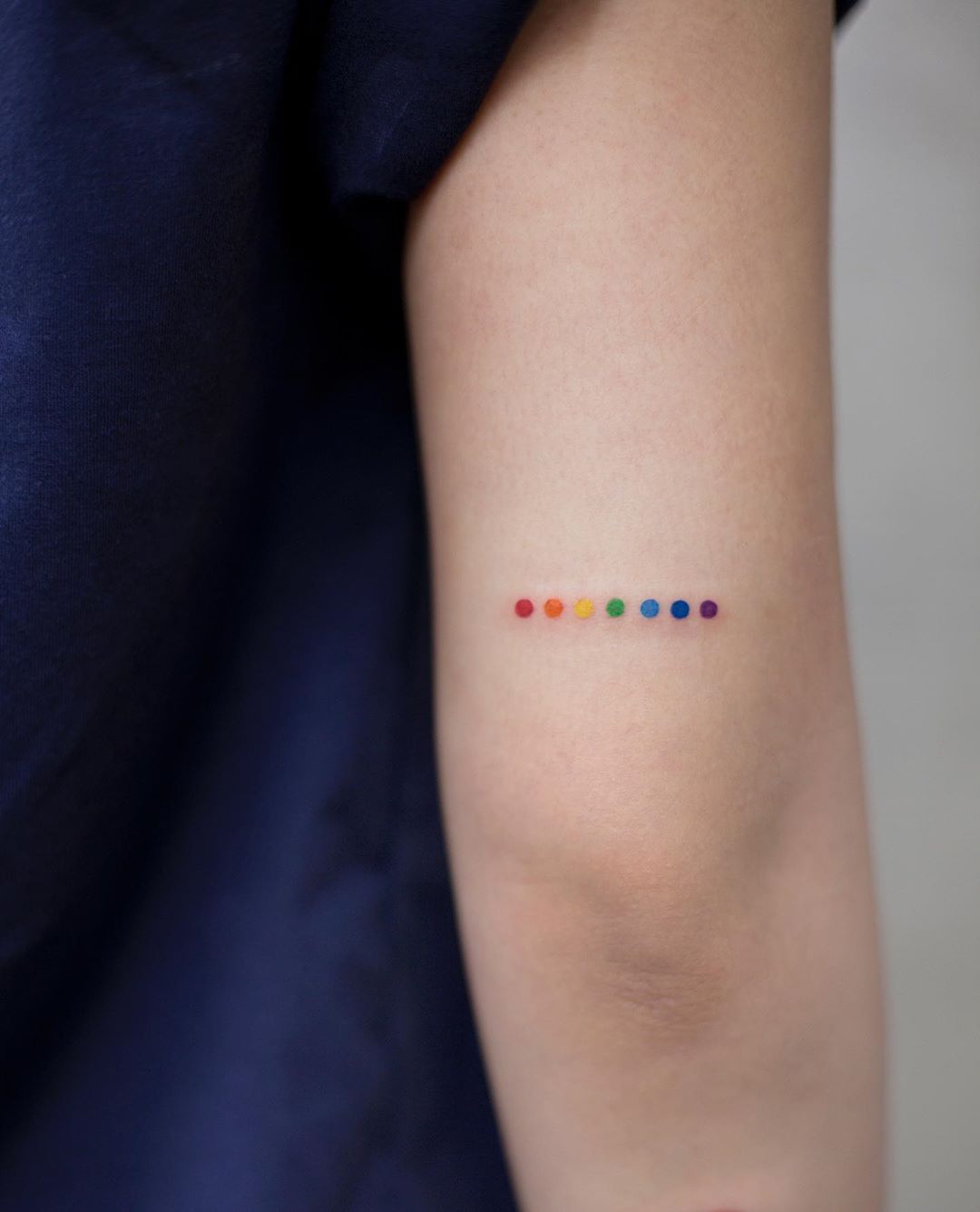 Rainbow dots tattoo by Aki Wong