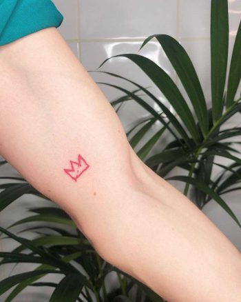 Red little crown tattoo by Loz Thomas