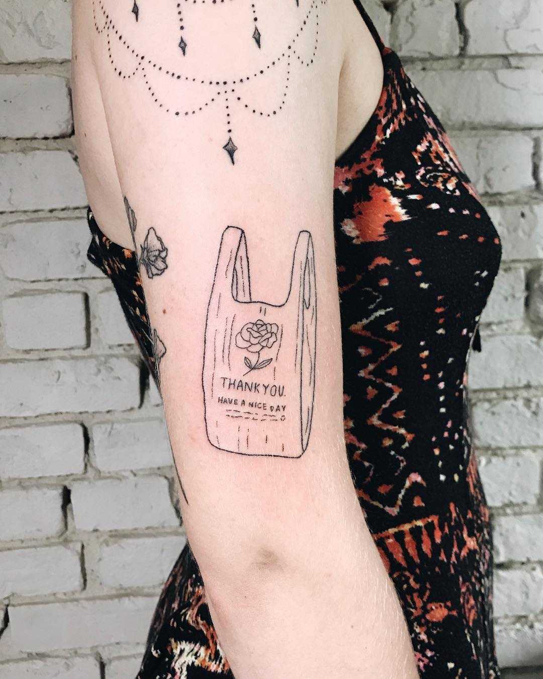 Shopping bag tattoo by Kelli Kikcio