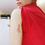 Simple red rose tattoo by Kelli Kikcio