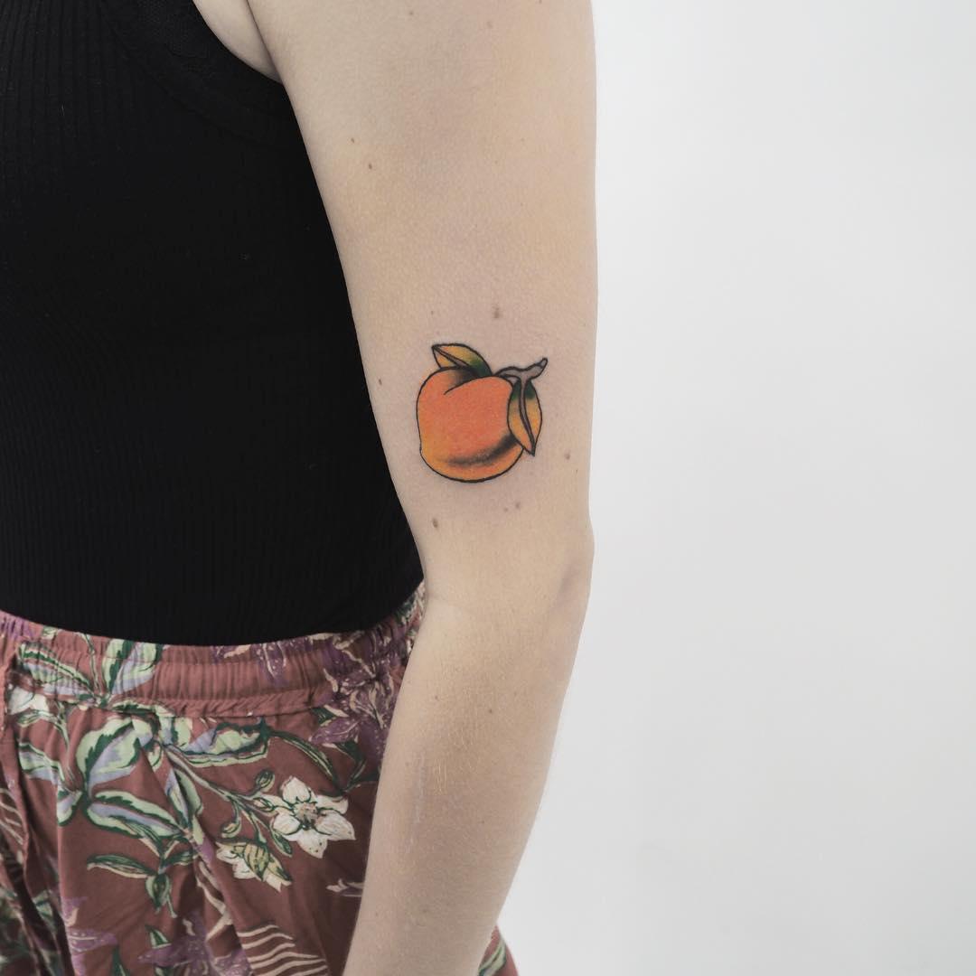 Small peach on the arm by anton1otattoo