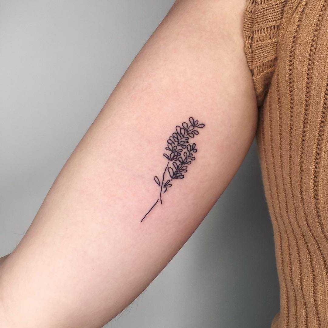Tiny lavender stems tattoo by Suki Lune