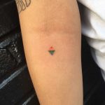 Tiny rainbow rhombus tattoo by Robbie Ra Moore