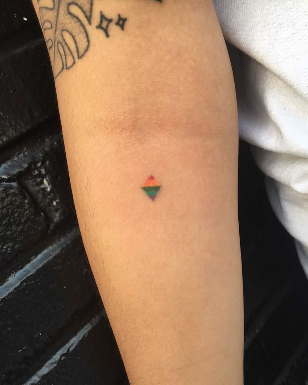 Tiny rainbow rhombus tattoo by Robbie Ra Moore