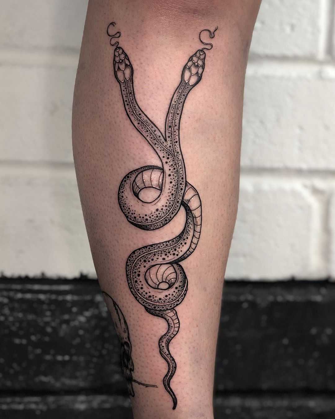 Two-headed snake tattoo by Lozzy Bones