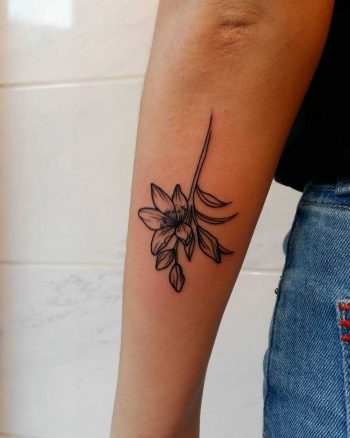 Upside down lily tattoo by Lara Simonetta