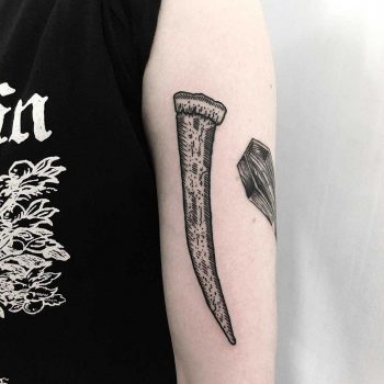 Walrus tusk tattoo by Deborah Pow