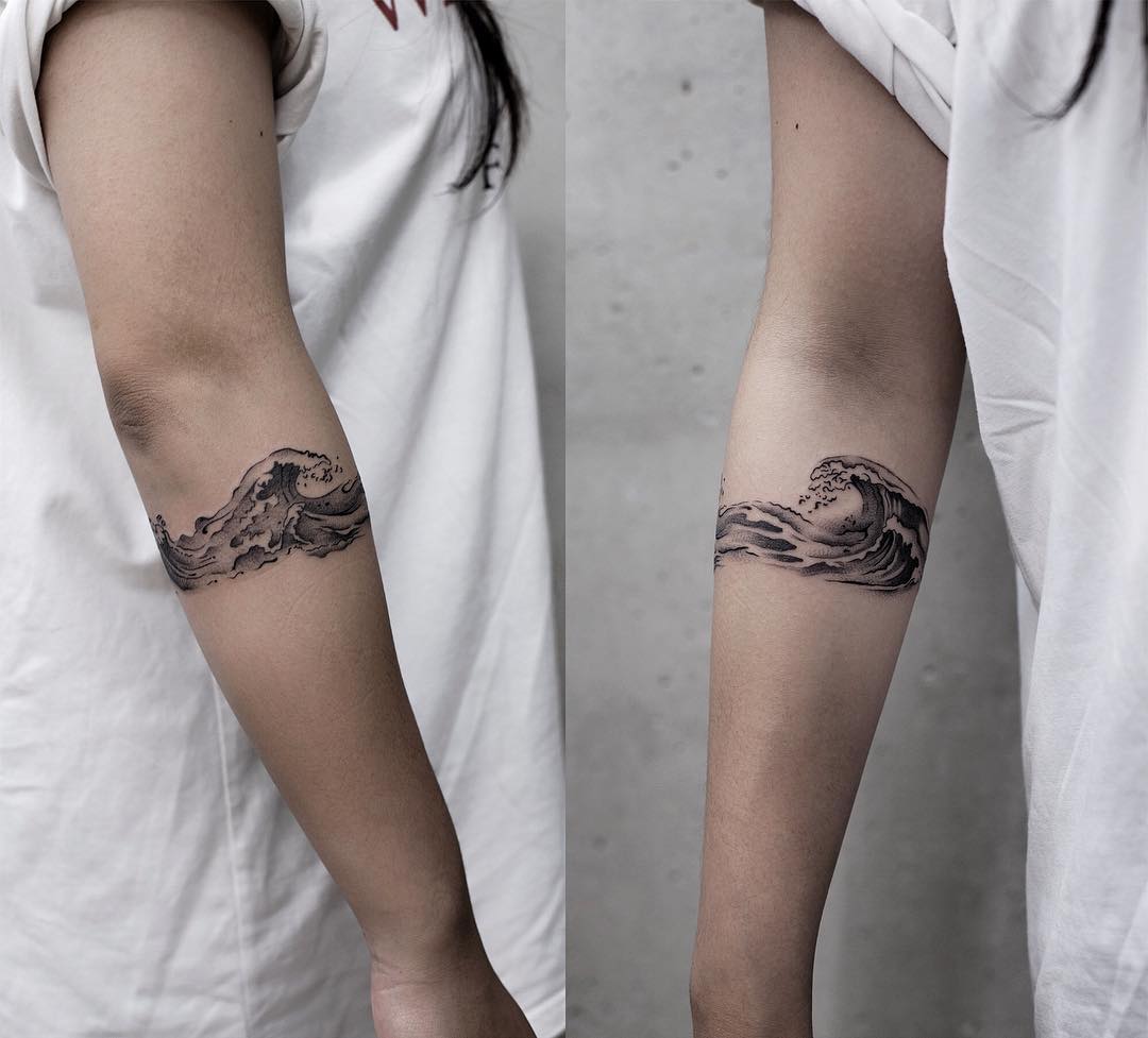 Wave armband tattoo by Aki Wong