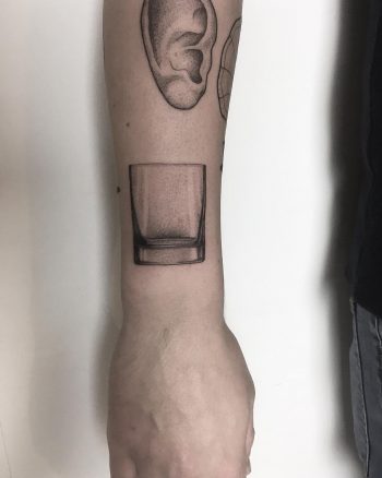 Whiskey tumbler tattoo by tattooist Spence @zz tattoo