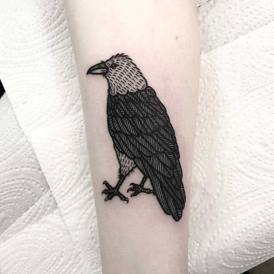 A blackwork bird tattoo by Deborah Pow