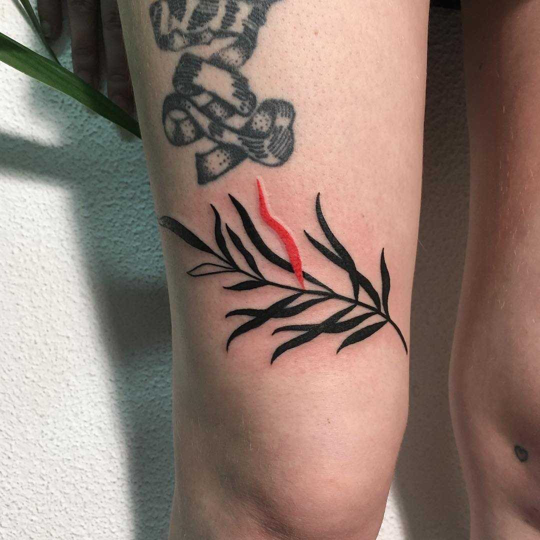 Black and red leaf tattoo by Agata Agataris