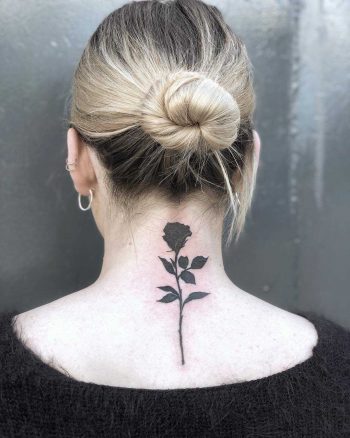 Black rose tattoo on the back by Loz McLean