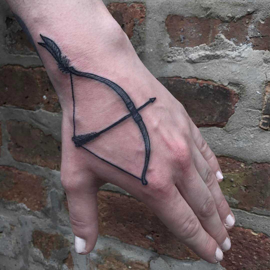 Bow and arrow tattoo by Tine DeFiore