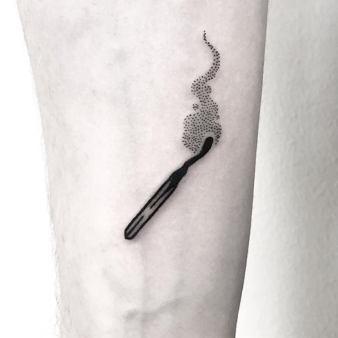 Burnt matchstick tattoo by Pulled Poltergeist