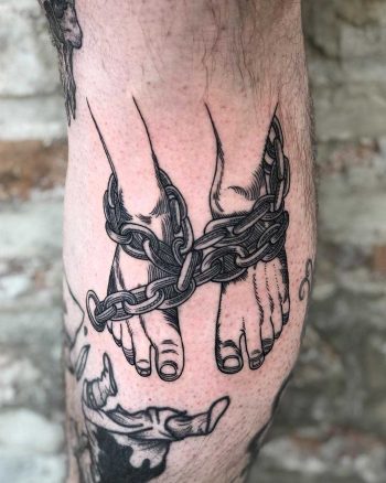 Chained legs tattoo by Tine DeFiore