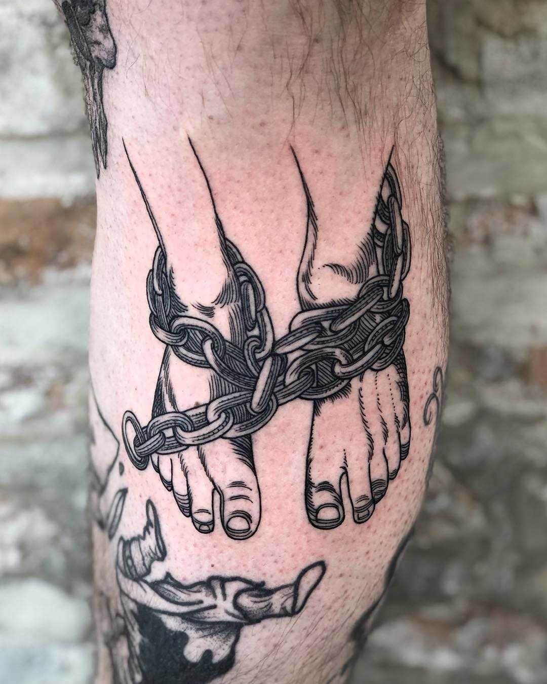 Chained legs tattoo by Tine DeFiore