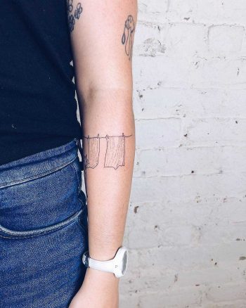Clothes line tattoo by Kelli Kikcio