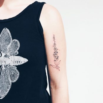 Delicate foxglove tattoo by Kelli Kikcio