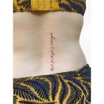 French quote tattoo on a back by Zaya Hastra