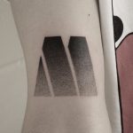 Gradient M tattoo by Oliver Whiting