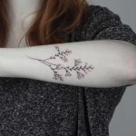 Hand-poked Montbretia tattoo by Lara Maju