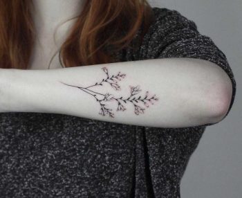 Hand-poked Montbretia tattoo by Lara Maju