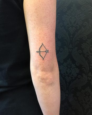 Hand-poked bow and arrow by Kirk Budden