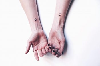 Hand-poked karma loops by Kelli Kikcio