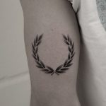 Hand-poked laurel wreath tattoo by Oliver Whiting