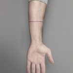 Hand-poked line tattoo by Lara Maju
