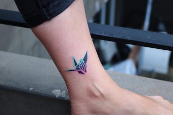 Hand-poked mini paper crane by zzizziboy