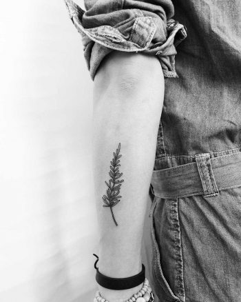 Hand-poked rosemary tattoo by Kelli Kikcio