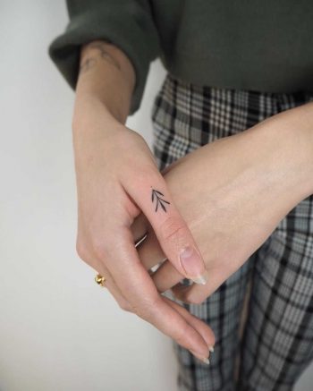 Hand-poked thumb ornament by Lara Maju