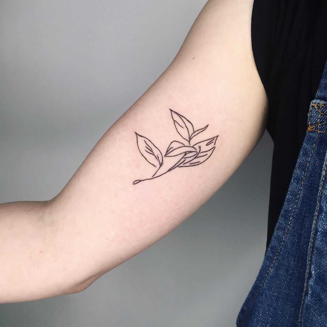 Little tea leaf tattoo by Suki Lune