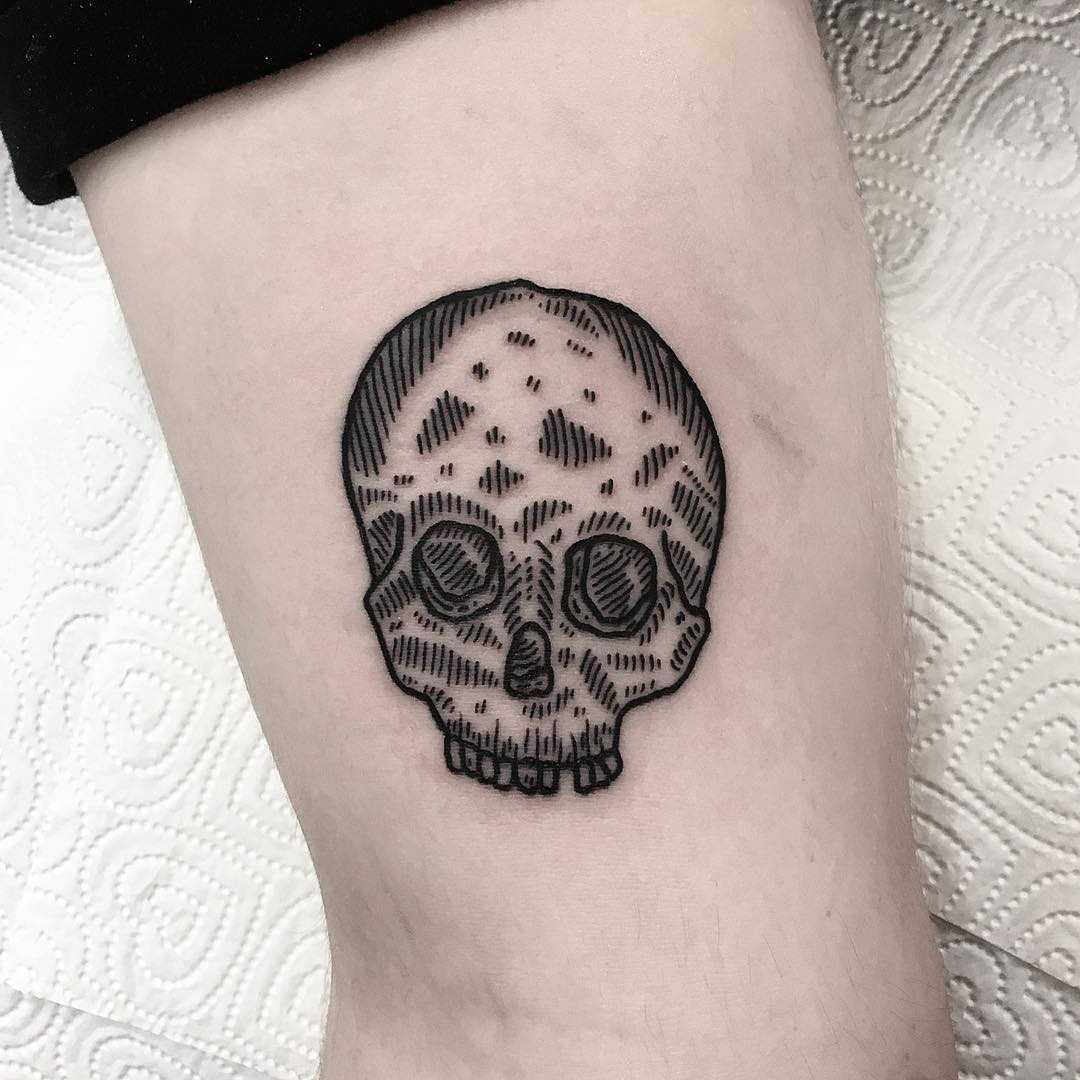 Little woodcut skull tattoo by Deborah Pow