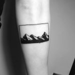 Minimalist mountain range tattoo by Chinatown Stropky
