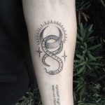 Mystical snake tattoo by artist Meritattoon